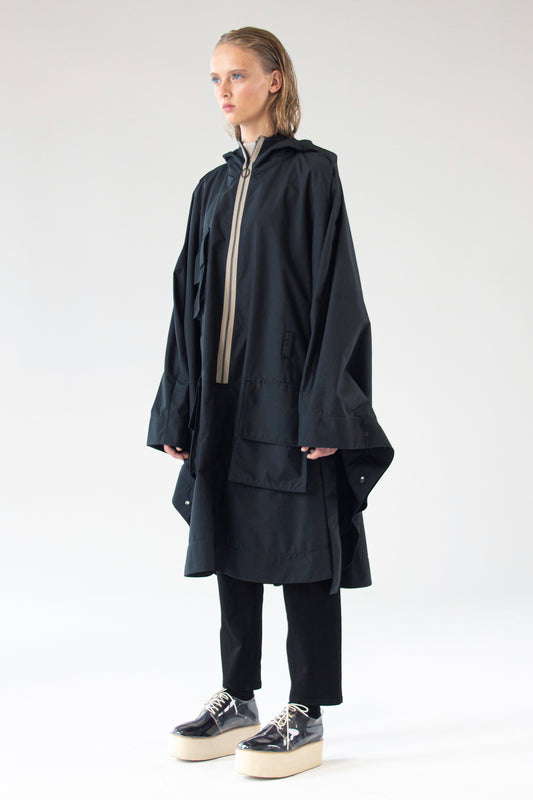 One Wolf Poncho SEEKER front view with contrast zipper and cargo pockets.