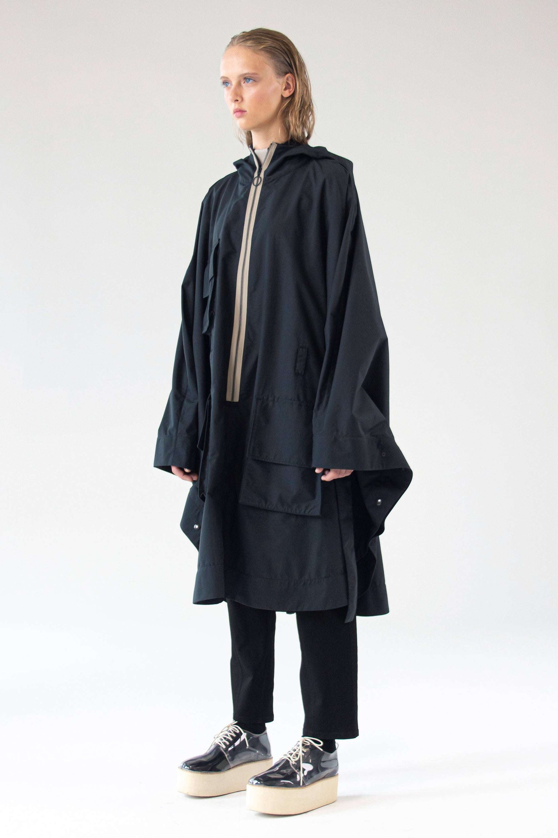 One Wolf Poncho SEEKER front view with contrast zipper and cargo pockets.