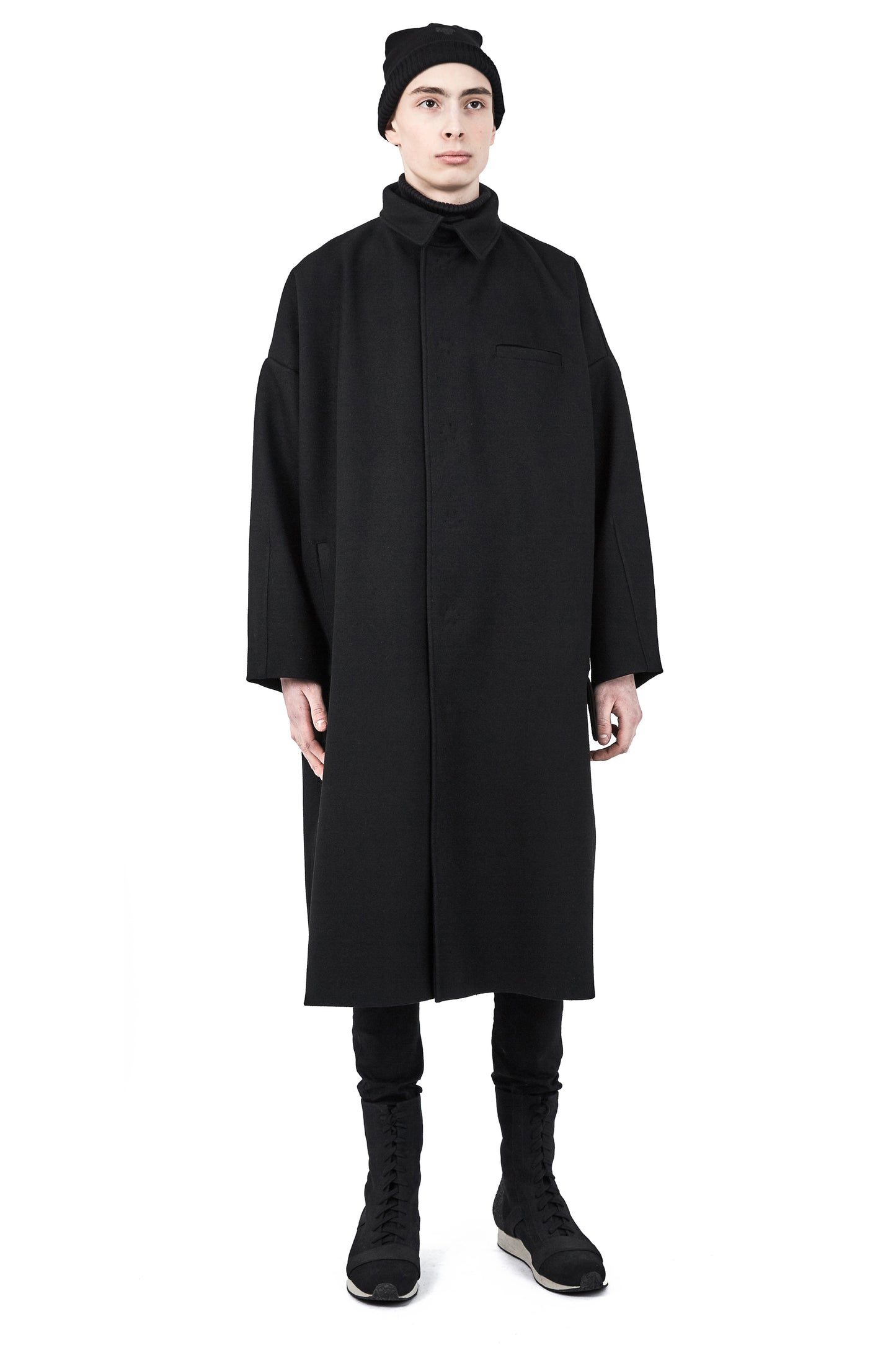 Unisex black wool beanie styled with One Wolf outerwear